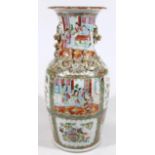 A 19thC Cantonese porcelain famille vert vase, with compressed trumpet stem, flanked by gilt