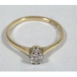 A ladies diamond 0.15cts 18ct gold solitaire ring, with claw set stone on plain shank, 2.1g all in.