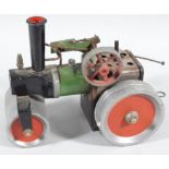 A 1960's Mamod style steam tractor, with cylindrical centre, articulated roller and wheels,