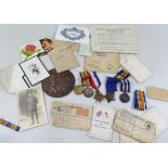 A generational group of medals, associated ephemera, death plaque etc., to include a Queen