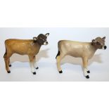 A Beswick Newton Tinkle calf, with tan and dark brown body, cream front feet, dark brown head and