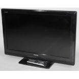 A Toshiba Regza 30" colour TV, with black trim and remote control.