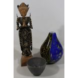 An unusual early 20thC figure group, formed as a lady, made up of strung pierced oriental coins,