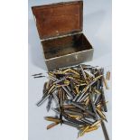 A quantity of pen nibs, in a base metal Canadian Pacific tin, marked S.S. Montlaurier 14cm wide, (