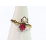 A ladies dress ring, claw set with pearl and pink stone, the plain shank marked 333, size K, in an