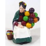 A Royal Doulton figure The Old Balloon Seller, HN1315, printed marks beneath, 21cm high.