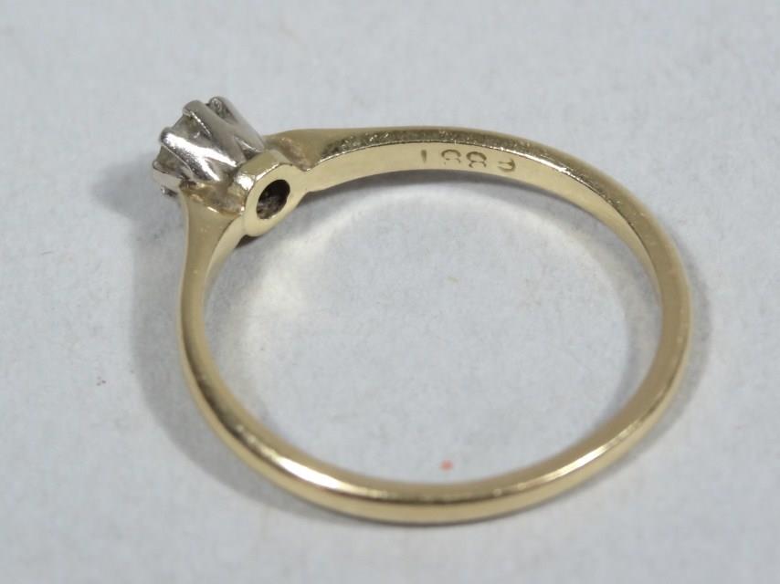 A ladies diamond 0.15cts 18ct gold solitaire ring, with claw set stone on plain shank, 2.1g all in. - Image 2 of 2