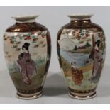 A pair of late Meiji period Japanese satsuma vases, each with a shouldered outline decorated with