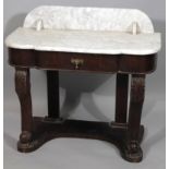 A late Victorian mahogany wash stand, with marble top, serpentine front, central drawer and scroll
