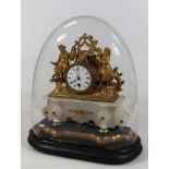 A 19thC gilt metal mantel clock, the 8cm dia. Roman numeric dial, revealing a key wind movement,