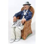 A Royal Doulton figure Taking Things Easy, HN2677, printed marks beneath, 18cm high.