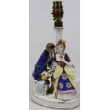 A mid 20thC Sitzendorf porcelain table lamp, formed as a courting couple, each dressed in finery,