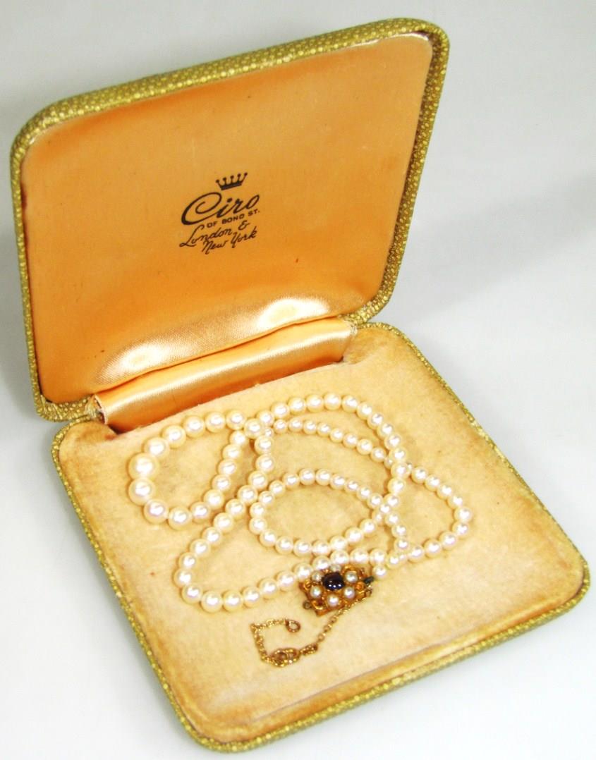 A ladies graduated pearl necklace, with elaborate 9ct gold clasp, set with further pearls and red - Image 4 of 5