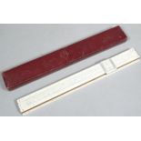 A mid 20thC slide rule, in pressed leather case, 32cm wide.