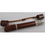 An early to mid 20thC chrome plated and pressed leather telescope, with articulated cylindrical