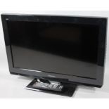 A Panasonic 23" colour television, in black trim with remote control.