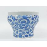 A Qing Dynasty blue and white jardiniere, late 19thC, of ogee form painted with flowers and