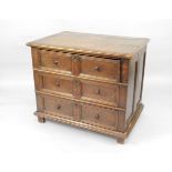 A 17thC and later oak chest, of three deep drawers with twin panel fronts and pierced brass key