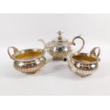 A George III silver and silver gilt three piece tea service, by James Barber & William Whitwell,