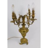 A Continental late 19thC ormolu four branch candelabra, of baluster form embossed with masks, rococo