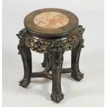 A Chinese late 19thC hardwood urn table, the marble inset circular top with a beaded edge, above a