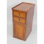 A Victorian mahogany pot cupboard, converted from a desk pedestal, with two drawers above a