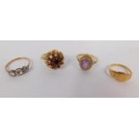 A 9ct gold and amethyst dress ring, size O, 9ct gold and claw set garnet cluster ring, size N, three