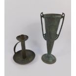 An Arts & Crafts hammered pewter chamber stick, 21cm high, and a WMFG type tin vase, 35cm high.