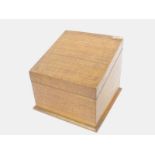 An oak stationery box, with slop top