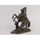 After Guillaume Coustou, a late 19thC bronze cast of a Marley Horse, 18cm high.