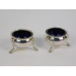 Withdrawn pre sale by Vendor. A pair of George III silver salts, of circular design on three hoof