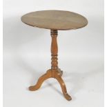 A 19thC oak occasional table, the oval top raised on a baluster turned column, over three cabriole