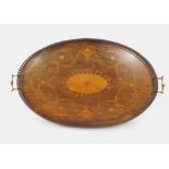 A Victorian oval rosewood tray, with a twin brass handled and galleried frame, inlaid with