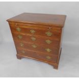 A George III oak bachelor's chest of drawers, with a brushing slide over four graduated long