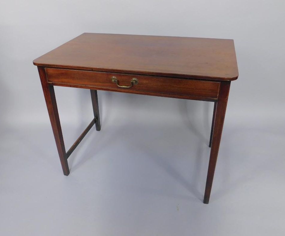 A George III mahogany side table, fitted with a single drawer, on square tapered legs, lacking