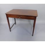 A George III mahogany side table, fitted with a single drawer, on square tapered legs, lacking