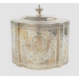 A George III silver tea caddy by Charles Aldridge & Henry Green, the shaped oval body headed by a