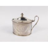 A George III silver mustard pot, the oval body with an upper and lower beadwork banding and fluted