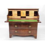 A George III figured mahogany secretaire chest, of four drawers, with upper secretaire drawer and