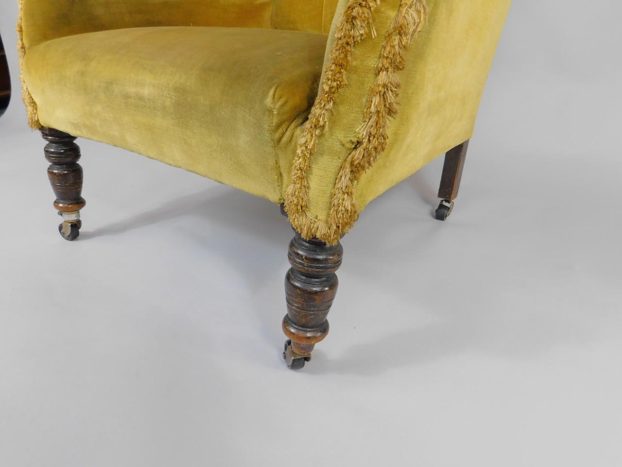 A Victorian mahogany framed wingback library armchair, upholstered in yellow fabric, raised on - Bild 2 aus 2