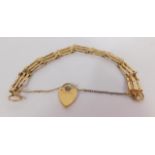 A 9ct gold three bar gate bracelet, on a heart shaped, padlock clasp, with safety chain as fitted,