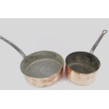 Two French copper saucepans with cast iron handles.