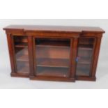 A Victorian mahogany breakfront side cabinet, with three central glazed doors, flanked by two