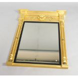 An early 19thC gilt gesso overmantel mirror, of inverted breakfront form, the frieze applied with