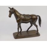 A loaded bronze figure of a horse, modelled standing, on an oblong base, 28.5cm x 13cm x 32cm.