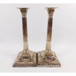 A pair of George III silver candlesticks, probably by Richard Rugg the First, each formed as