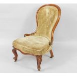 A Victorian mahogany balloon back nursing chair, with button back upholstery and over stuffed