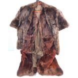 A fur lined wool gillet and a mink wrap.