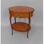 A French Kingwood and mahogany parquetry oval etagere, with brass mounts, single frieze drawer,