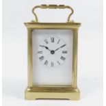 An early 20thC carriage clock, the white 5.5cm backplate with Roman numeric dial, in a rectangular